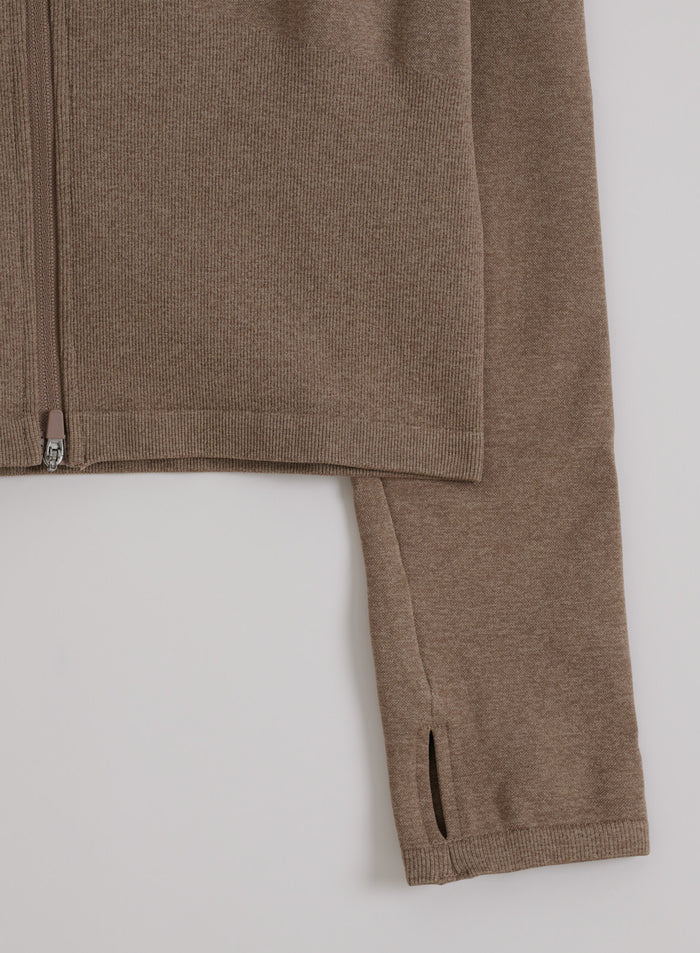 Espresso melange seamless zip jacket shown in a flat lay detail with ribbed hem and thumbhole sleeve.
