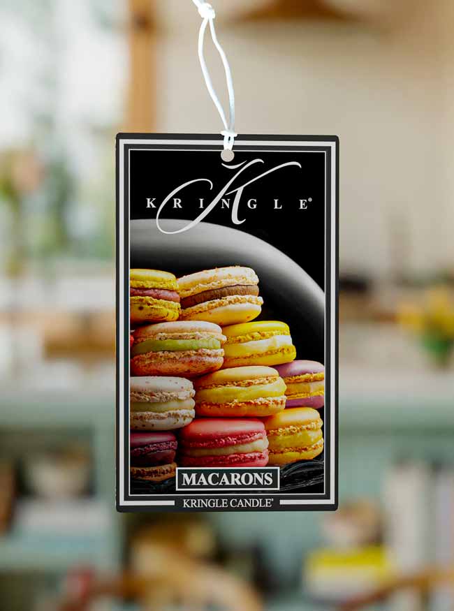 Kringle Candle macaron air freshener with a blurred background