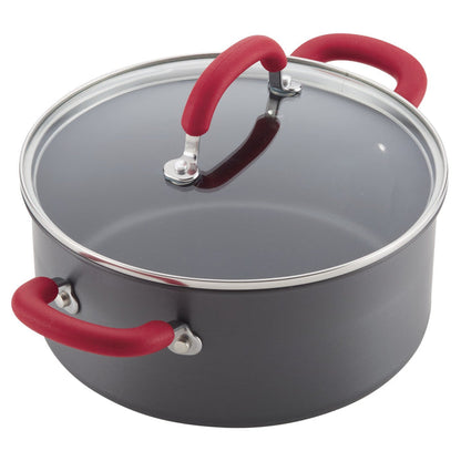 Induction-ready pot with red handles and glass lid from 11-pc cookware set.