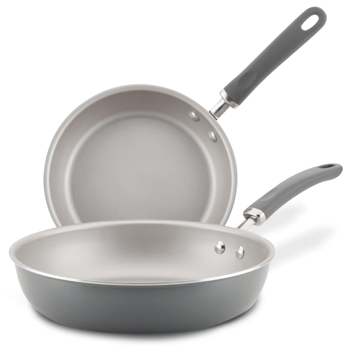 9.5" and 11.75" gray nonstick pans with black handles on a white background.