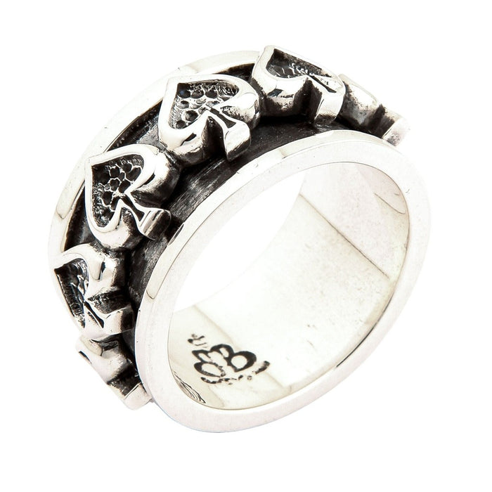Angled view of 925 sterling silver ace of spades spinner ring displaying three-dimensional spade designs