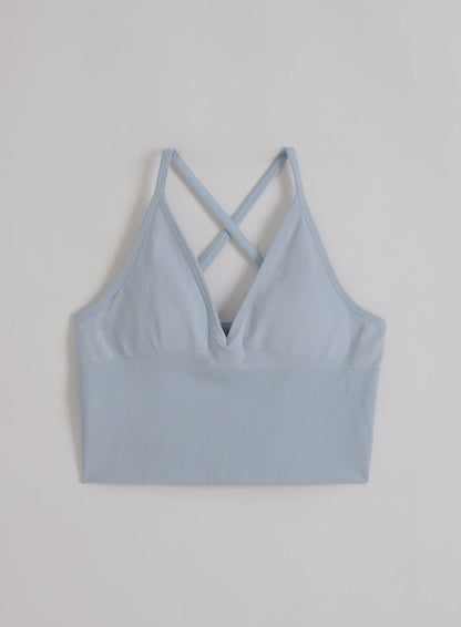 Aura blue aim'n Shape Seamless Cross Back Bralette with ribbed detailing in a flatlay.