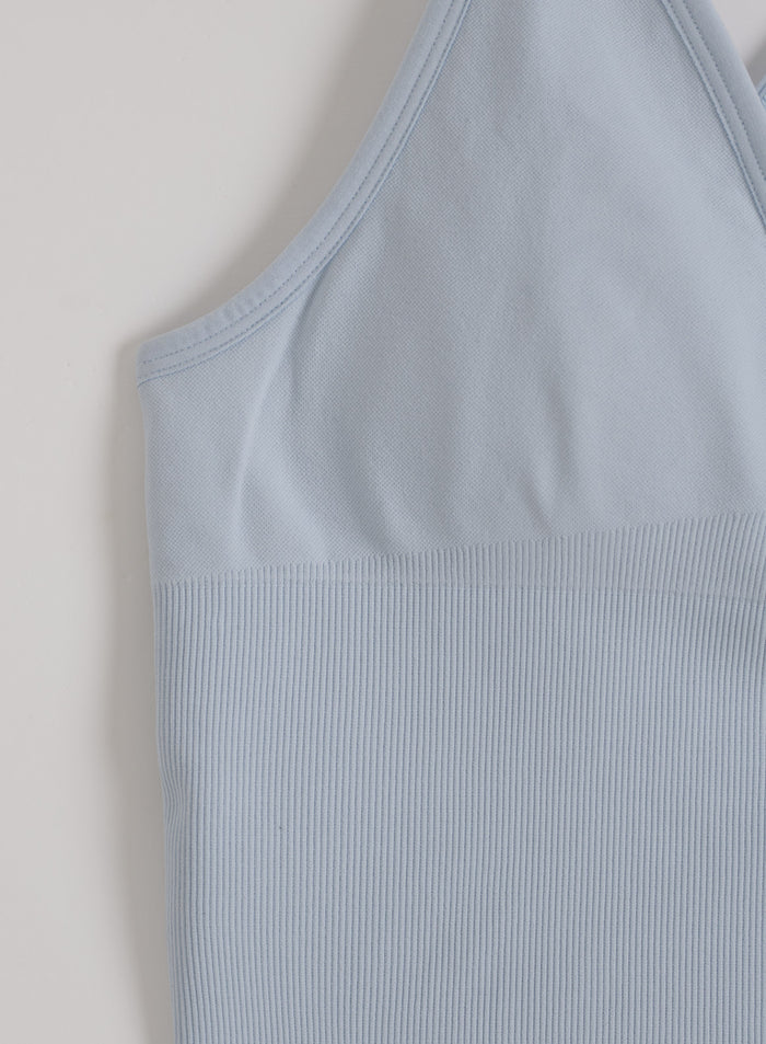 Light blue Aura shape seamless cross back bralette from aim'n featuring a ribbed underband.