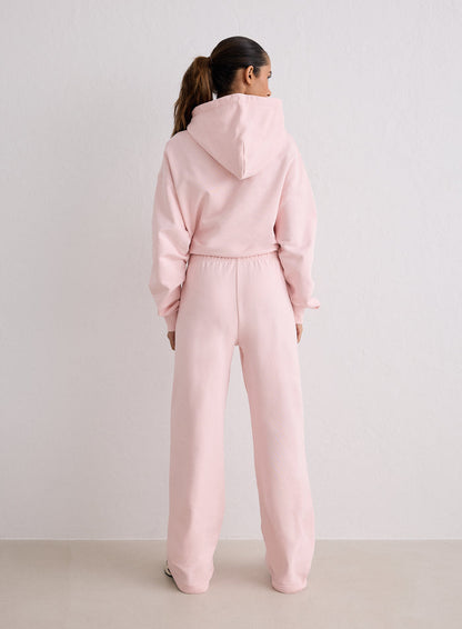 A woman seen from behind wearing pink Ballerina Chunky Terry Sweatpants and a matching hoodie from aim'n [S-170cm]