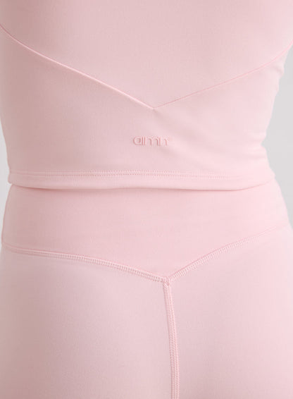 Close-up of the back of the pink Ballerina Sense Bralette and matching tights featuring V-shaped seams and a tonal aim'n logo [XS-170cm]