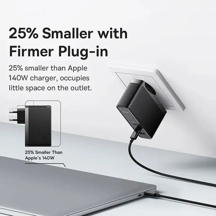 Compact black charger plug with a cable connected to a laptop.
