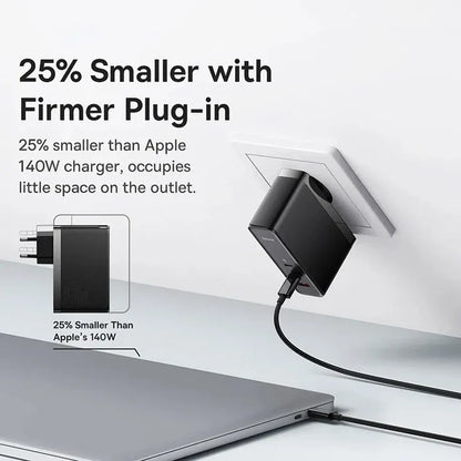 Compact black charger plug with a cable connected to a laptop.