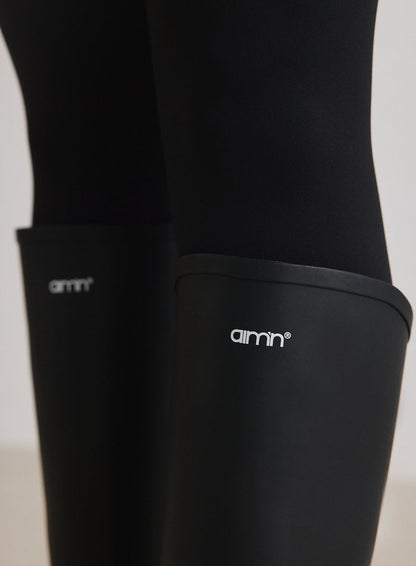 Close-up of the logo on the Black Rain Boots from aim'n