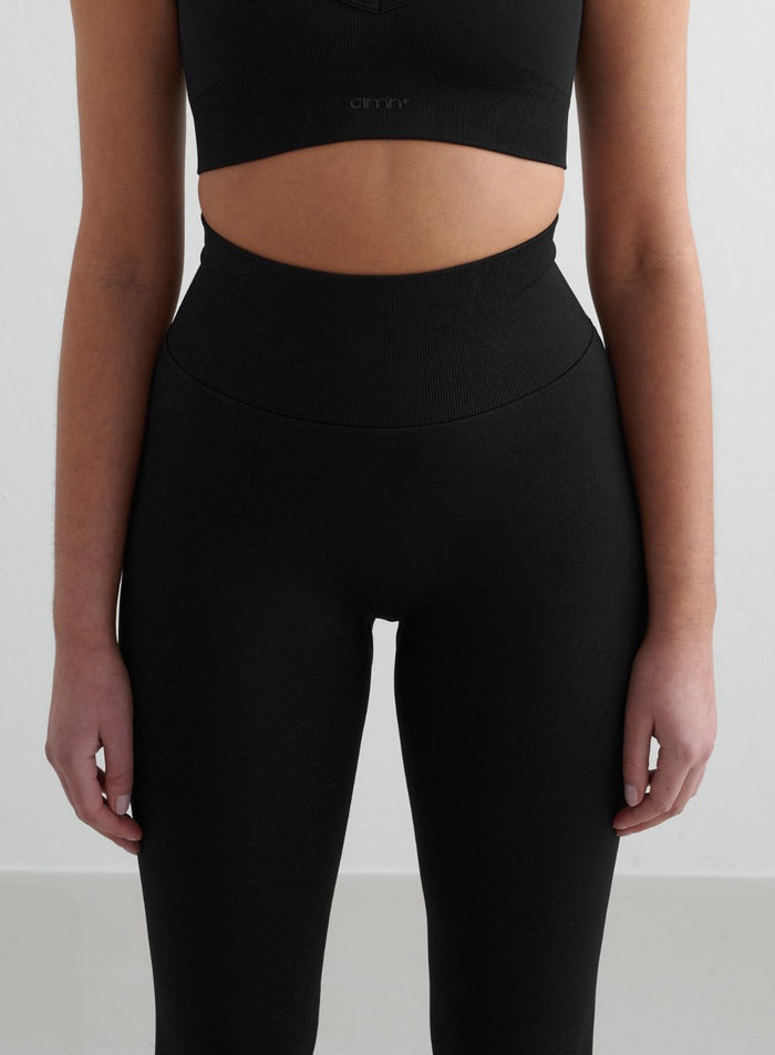 Front close-up of black Shape Seamless Tights by aim'n with a high ribbed waistband [S - 175 cm]