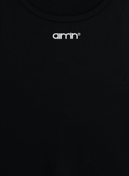 Close-up of black Soft Basic Singlet featuring round neckline and white printed aim'n logo at front.