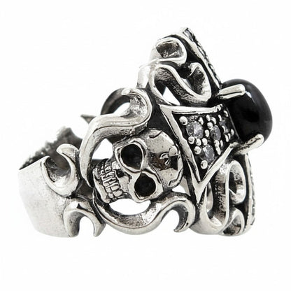 The side of the ornate silver cross ring