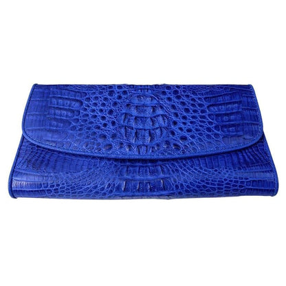 A genuine crocodile skin wallet for women in a vibrant blue color.