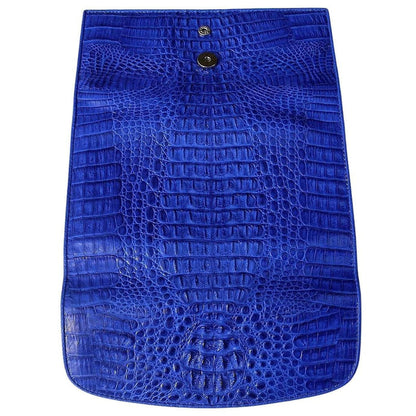 The open flap of the blue crocodile hornback wallet, displaying the magnetic snap and full scale pattern.