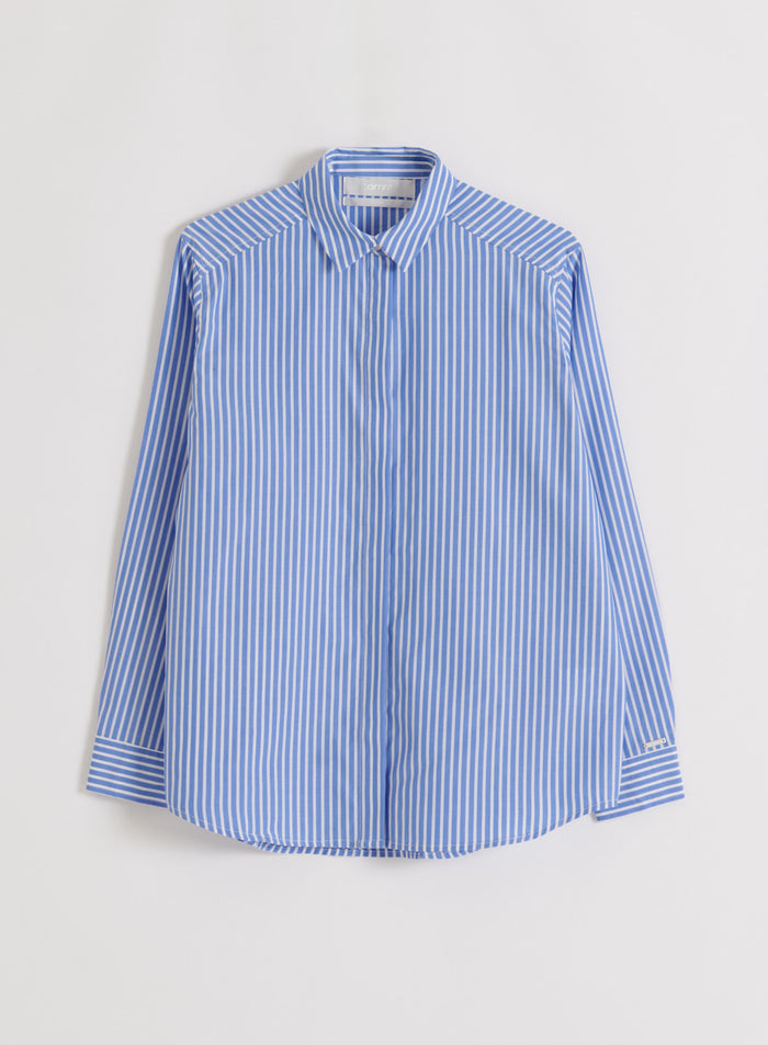Blue and white striped poplin shirt laid flat