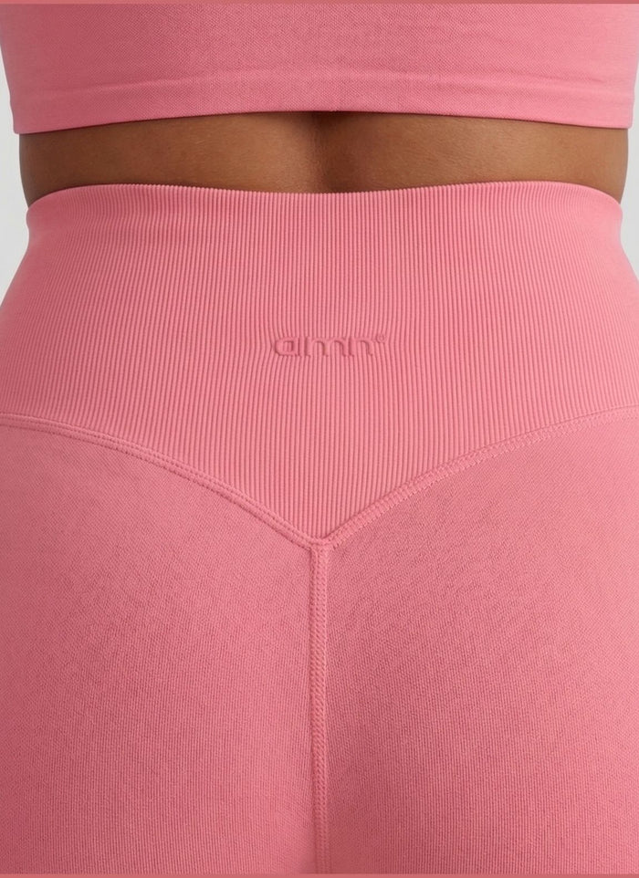 Rear view of blush Shape Seamless Hotpants showing the high ribbed waist and tonal aim'n logo. [S-175cm]