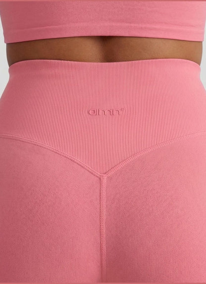 Rear view of blush Shape Seamless Hotpants showing the high ribbed waist and tonal aim'n logo. [S-175cm]