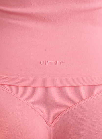 Close-up of the aim'n logo and ribbed texture on the Blush Shape Seamless One Shoulder Bralette [L-174cm]