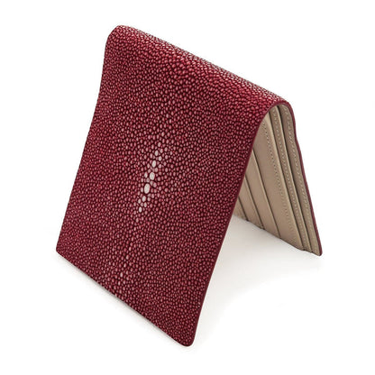 A luxury exotic leather wallet for men, meticulously crafted from authentic polished burgundy stingray.