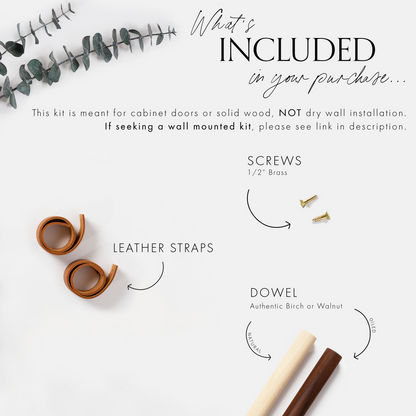 Keyaiira cabinet mount kit flat lay showing included components: two rolled leather straps, ½ inch brass screws, and wooden dowels in birch or walnut. Displayed with minimal botanical styling on white background.