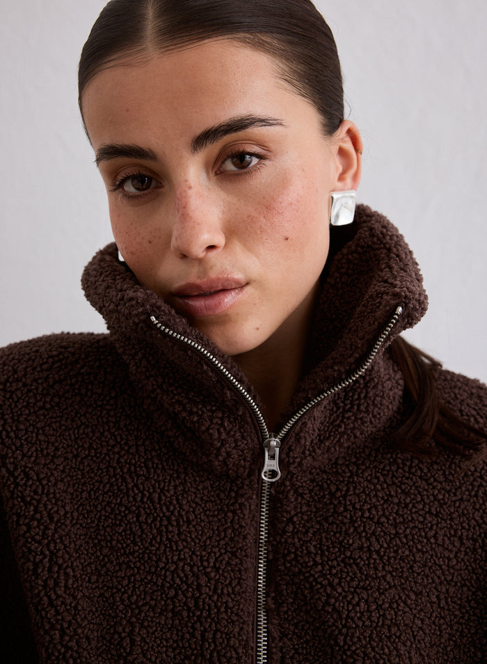 Close-up of a woman wearing the Cacao Pile Jacket [M-174cm]
