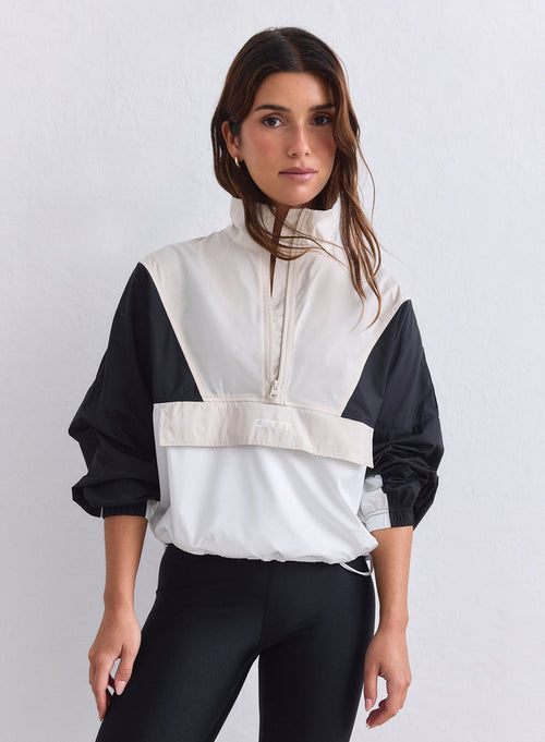 Color-blocked windstopper jacket in Café Au Lait with a half-zip and high collar from aim'n. [S-165cm]