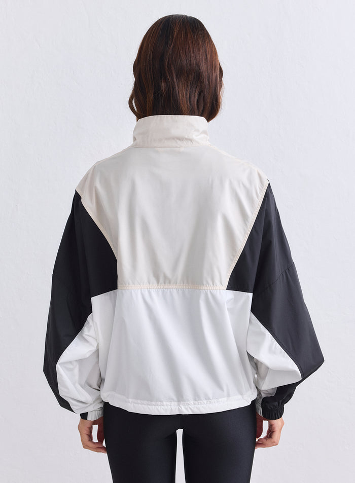 Back view of the aim'n Café Au Lait Balance Blocked Windstopper Jacket with a relaxed fit [S-165cm]