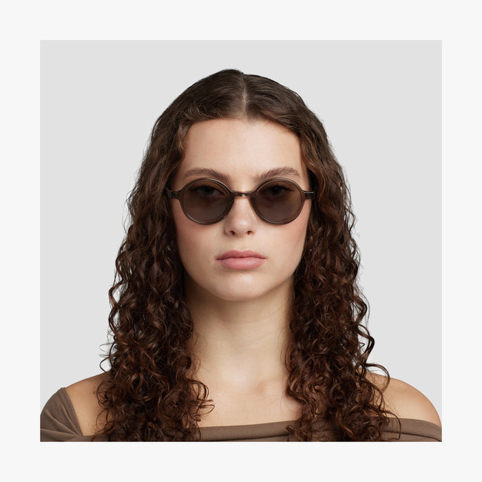 Crystal Sencha / Grey Green Lens | Front view of female model wearing Cairn Sunglasses in Crystal Sencha with Grey Green Lens