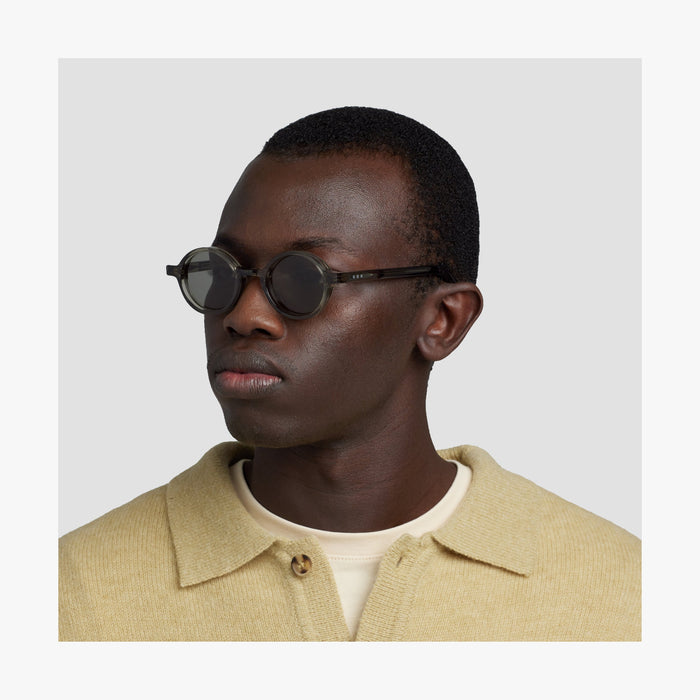 Crystal Sencha / Grey Green Lens | Side view of male model wearing Cairn Sunglasses in Crystal Sencha with Grey Green Lens