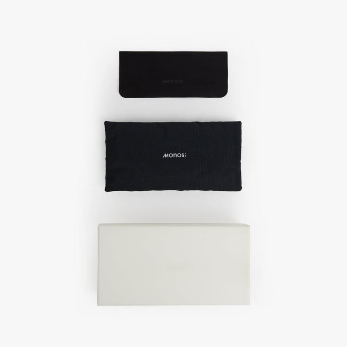 Crystal Sencha / Grey Green Lens | Top view of the white gift box, black fabric bag with Monos logo and microfibre cleaning cloth
