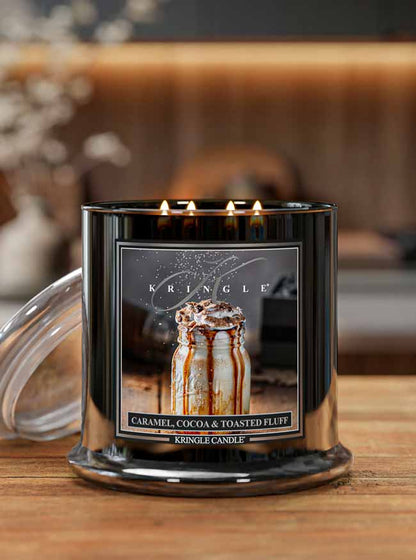 Kringle Candle with 'Caramel, Cocoa & Toasted Fluff' flavor on a wooden surface.