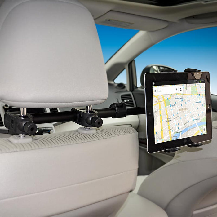 A Center Extension Car Headrest Slim-Grip® Tablet Mount holds a tablet displaying a map app behind a car seat, making rear seat entertainment convenient and accessible. The mount fits iPad, Note, and more; car interior is visible in the background.