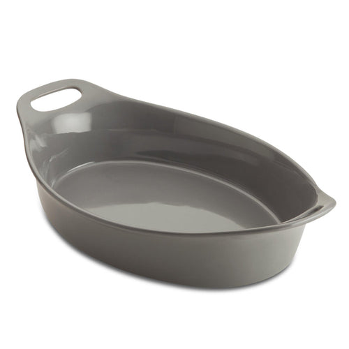 The Ceramic Oval Bakers, featuring a convenient handle, sits empty against a pristine white background. Designed for versatility, it transitions effortlessly from freezer to oven, making your culinary creations both stylish and effortless.