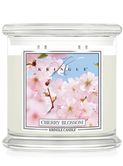 Kringle Candle Cherry Blossom 4-wick scented candle with cherry blossom design on the label.