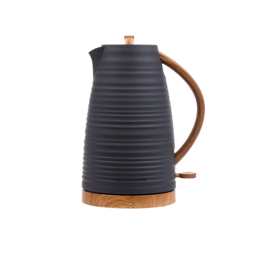Black electric kettle with wooden base and handle on a white background