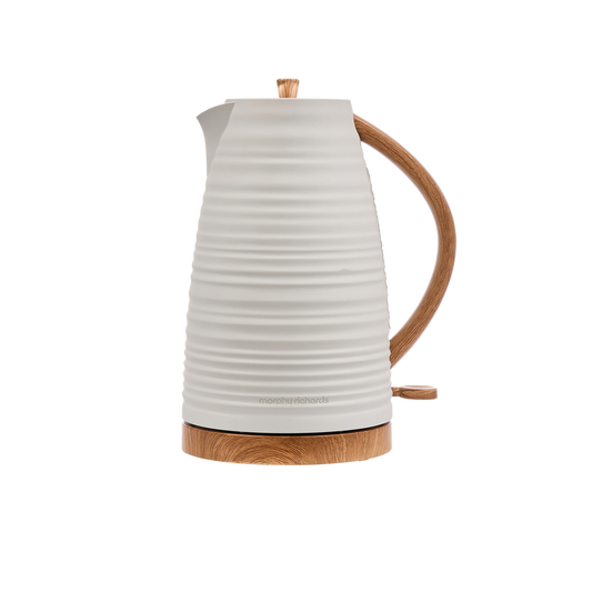 White electric kettle with wooden handle and base on a white background