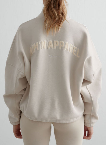 Back view of the clay Campus Sweat Zip Jacket from aim'n, featuring textured teddy artwork for a cozy look.