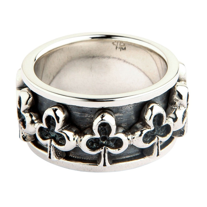 Club sterling silver spinner ring front view showing raised trefoil motifs on oxidized band
