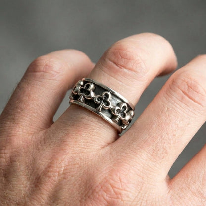 Club sterling silver spinner ring worn on finger demonstrating 13mm band width