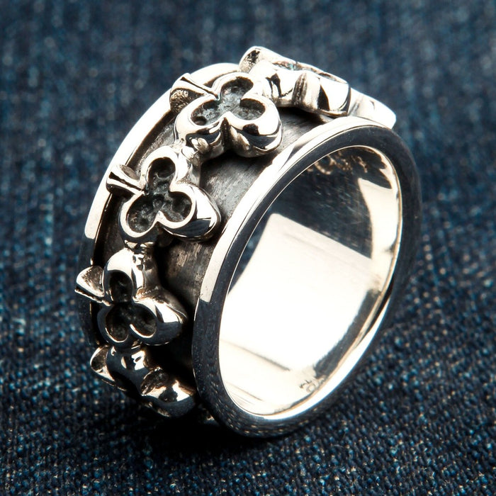 Detail shot of club spinner ring highlighting oxidized background and raised silver clubs
