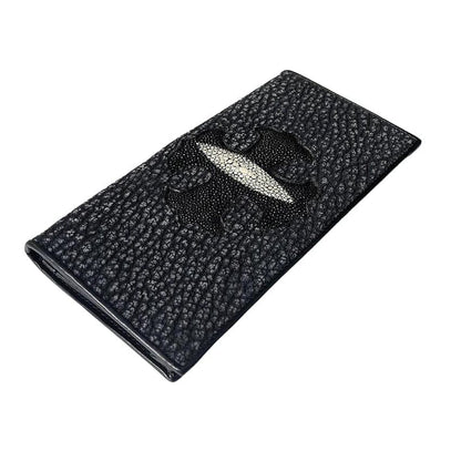 Black stingray leather long wallet with a textured surface, featuring a white stingray eye centered in a raised black cross, viewed from an angle