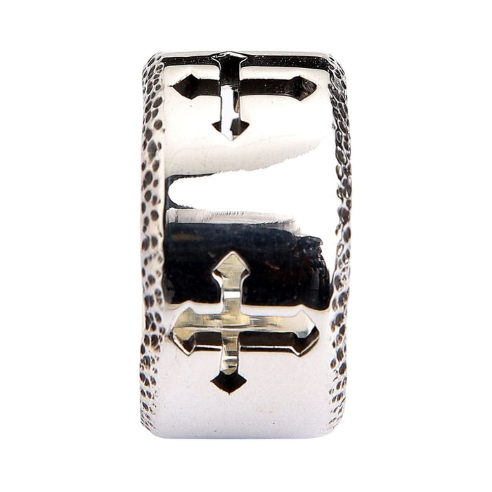 A premium wide-band sterling silver cross ring with rugged, stippled borders and a smooth, comfortable interior.