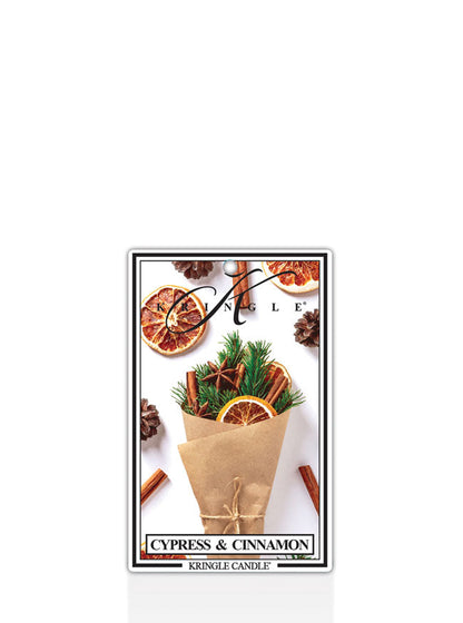 Kringle Candle Cypress and Cinnamon air freshener with cypress and cinnamon elements on a white background