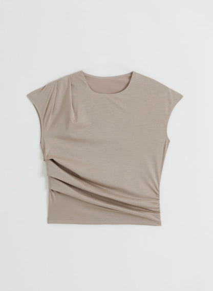 A flatlay of the Dark Clay Luminous Draped Short Sleeve top by aim'n.