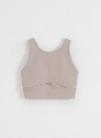 Dark clay aim'n Sense Sports Bra with a high neckline and soft brushed fabric, shown in a flatlay.
