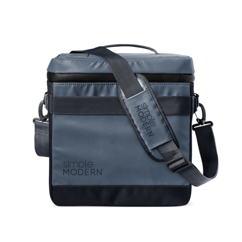 Slate blue-gray crossbody bag with black webbing strap and black accent details, modern neutral design