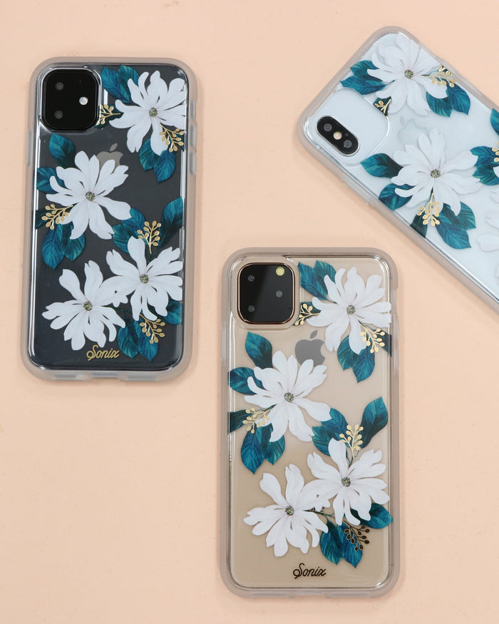 delicate white flowers with gold foiled pollen details shown on galaxy phone