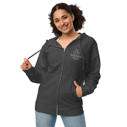 Embroidered logo unisex fleece zip-up hoodie, charcoal color, worn by smiling person.