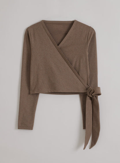 Espresso Melange aim'n Shape Seamless Wrap Long Sleeve top featuring side ties in a flatlay presentation.