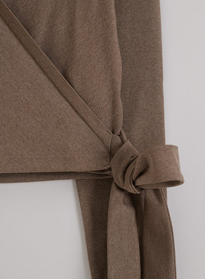 Espresso melange seamless wrap long sleeve top featuring an adjustable tie detail at the side.