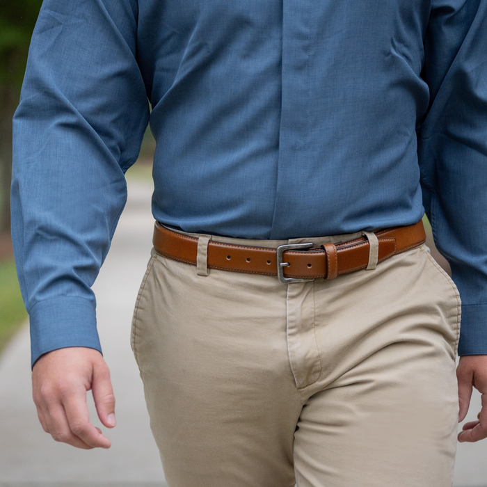 Explorer Tan Leather Belt on a male model in a blue button up and khakis